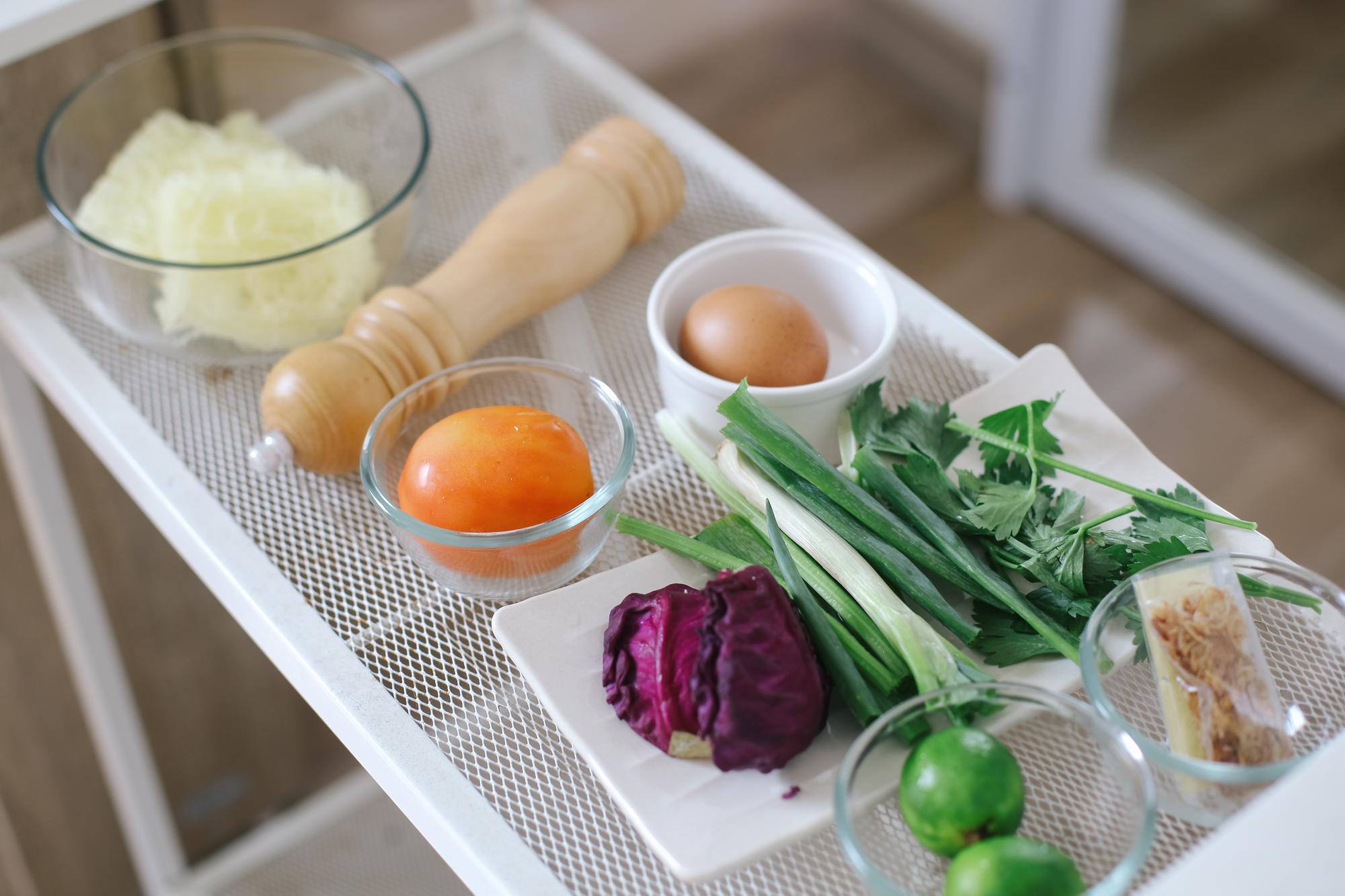 Clean kitchen counter with tools and vegetable prep